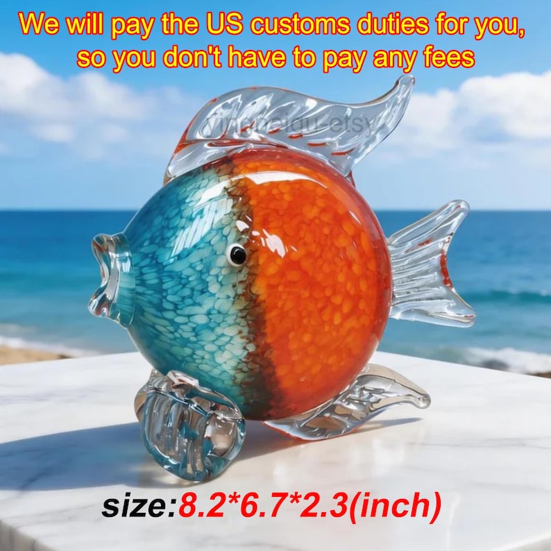 May include: A decorative glass fish sculpture with a vibrant color scheme. The fish features a blue and orange design, with clear fins and tail. The dimensions are 8.2*6.7*2.3 inches. The text in the image says "We will pay the US customs duties for you, so you don't have to pay any fees."