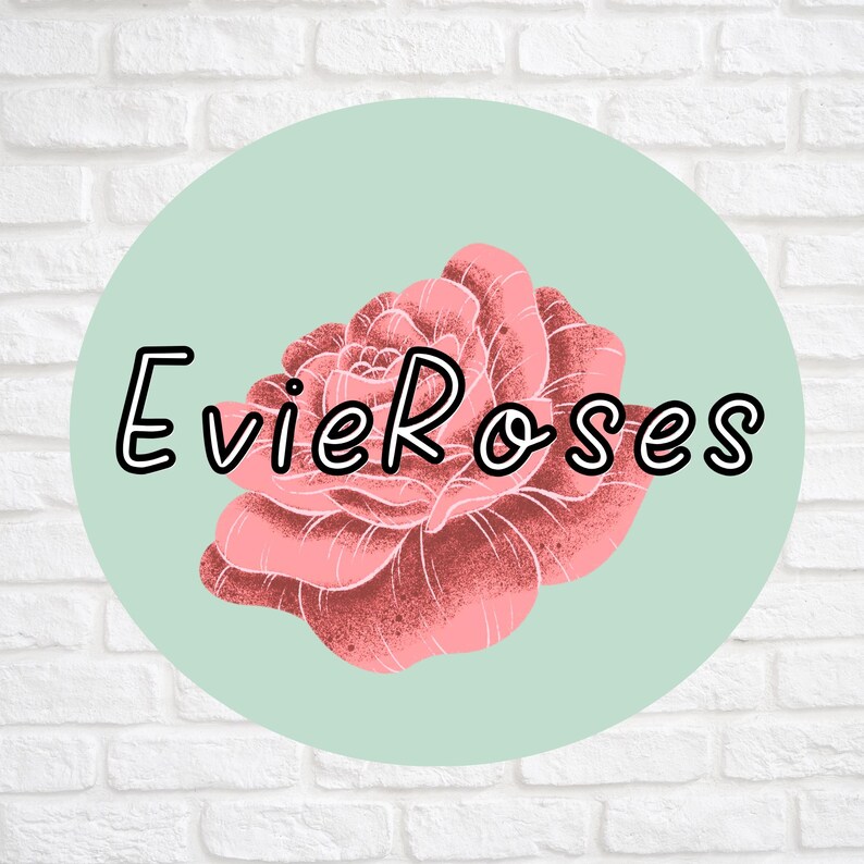 May include: A logo featuring a pink rose illustration inside a light green circle. The text "Evie Roses" is written in black, outlined letters above the rose. The background is a white brick wall.