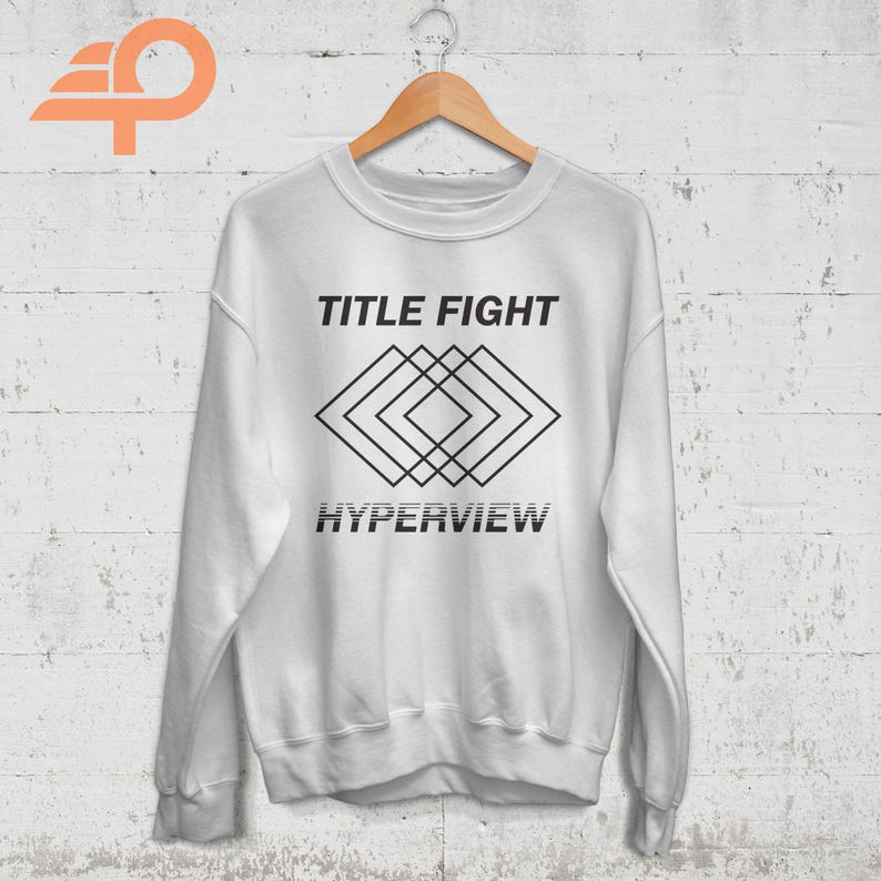 May include: White sweatshirt with black text that reads "TITLE FIGHT" and a geometric design below the text that reads "HYPERVIEW".