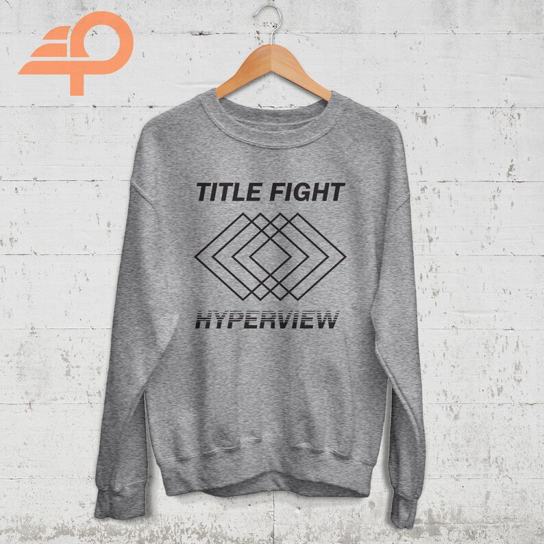 May include: Gray sweatshirt with black text that reads "TITLE FIGHT" and a geometric design with the text "HYPERVIEW" below.