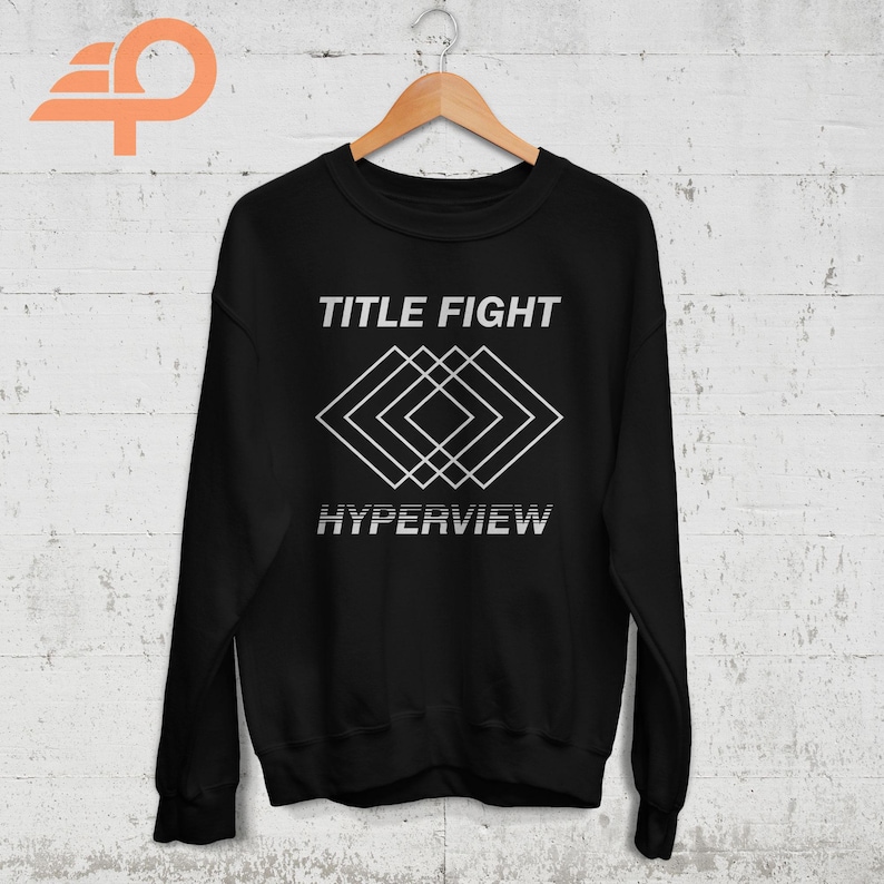 May include: Black sweatshirt with a white graphic design featuring the text "TITLE FIGHT" and "HYPERVIEW" with a geometric pattern of overlapping squares.