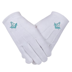 May include: A pair of white cotton gloves, each embroidered with a teal Masonic symbol. The gloves are displayed against a white backdrop, with the fingers of one glove overlapping the other.