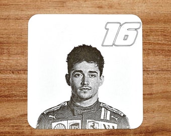 May include: A black and white photo of a race car driver wearing a racing suit with the number 16 on the top of the image.