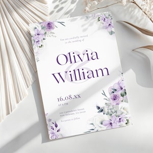 May include: A wedding invitation with the names "Olivia & William" in purple script. The invitation is decorated with watercolor floral arrangements in shades of purple and white. The text includes the date, time, and location.