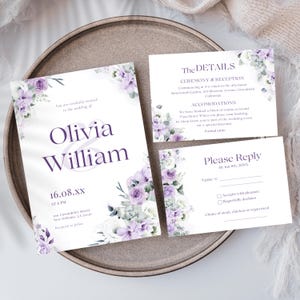 May include: Wedding invitation suite featuring a white background with purple floral accents. The invitation includes the names "Olivia & William" and event details. A reply card and details card are also included, all with matching floral designs.