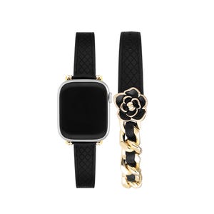 May include: A black and gold watch band with a black flower charm. The band is made of a textured leather material and has a chain link design.