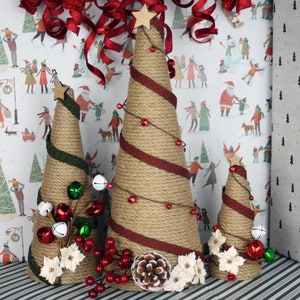 3 pc Jute Tree Set with red/green plaid accents, jingle bells, and white paper poinsettias with pine cones