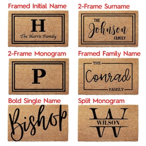 May include: Six rectangular tan coir doormats featuring black text and border designs. The styles include framed initials, surnames, monograms, and family names with text such as The Harris Family, The Johnson Family, P, The Conrad, Bishop, and Wilson.