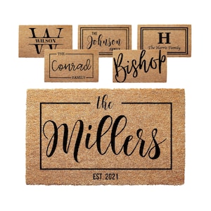 May include: A set of 6 personalized doormats with different family names and established dates. The doormats are made of coir and have a natural brown color. The text is black and includes the family names, "The", "Family", and "EST. 2021".
