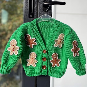 gingerbread motif cardigan for sale, crochet cardigan with cookie man motif for toddler, knitted green christmas cardigan for kids