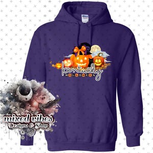 May include: Purple hoodie with a graphic of pumpkins and a black cat with the text "Kentucky Halloween".