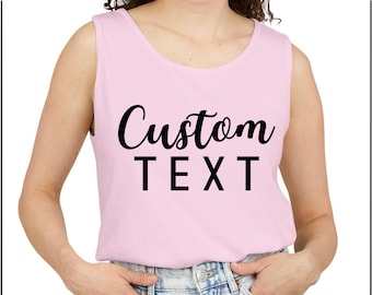 May include: A pink sleeveless tank top with the text "Custom TEXT" printed in black.