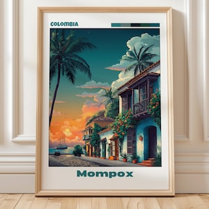 Puede incluir: Una impresión enmarcada que presenta una vibrante escena costera en Colombia. La obra de arte representa edificios coloridos, palmeras y una puesta de sol sobre el océano. La palabra "Colombia" está en la parte superior y "Mompox" en la inferior.