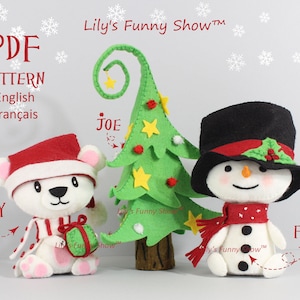 May include: A felt Christmas tree with yellow stars, a white polar bear wearing a red and white striped scarf and holding a green gift, and a snowman wearing a black top hat, red scarf, and holly. The text "Lily's Funny Show™" is on the top of the image.
