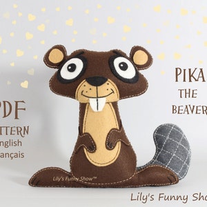 May include: PDF pattern for a felt beaver plush toy named Pika. The beaver is brown with a gray tail and has a big smile. The pattern is available in English and French.