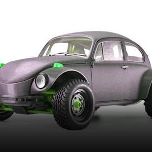 May include: A black and green off-road Volkswagen Beetle with large tires and a green trim around the headlights.