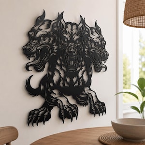 May include: A black metal wall art piece depicting a three-headed dog with sharp teeth, pointed ears, and clawed paws. The design features intricate cutouts that define the fur texture and facial expressions of the mythical creature in a flat style.