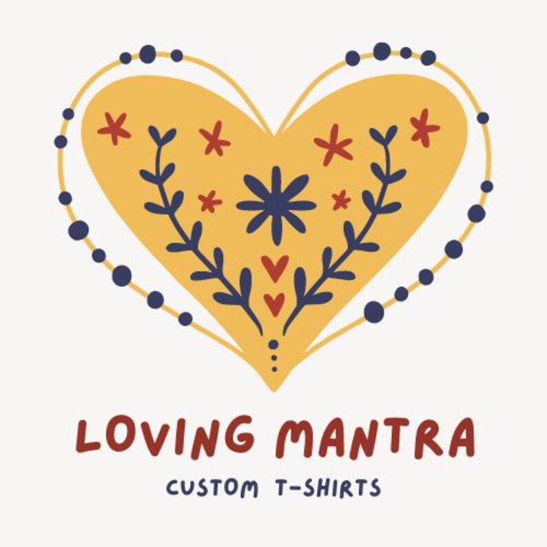 May include: A yellow heart with a floral design in red, blue, and white. The heart is surrounded by a blue dotted line. The text "LOVING MANTRA CUSTOM T-SHIRTS" is below the heart.