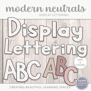 May include: White and pink alphabet letters with white polka dots. The letters spell out "Display Lettering ABC ABC". The text "Dots & Colors" is in a circle above the letters. The text "Creating Beautiful Learning Spaces" is at the bottom of the image.