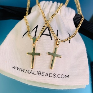 Our latest addition to our Cross Necklaces! Flaunt your faith or gift the perfect protection cross necklace. A dainty gold filled Chain adorned with a thick cross. Your item will be beautifully packaged ready for gifting.