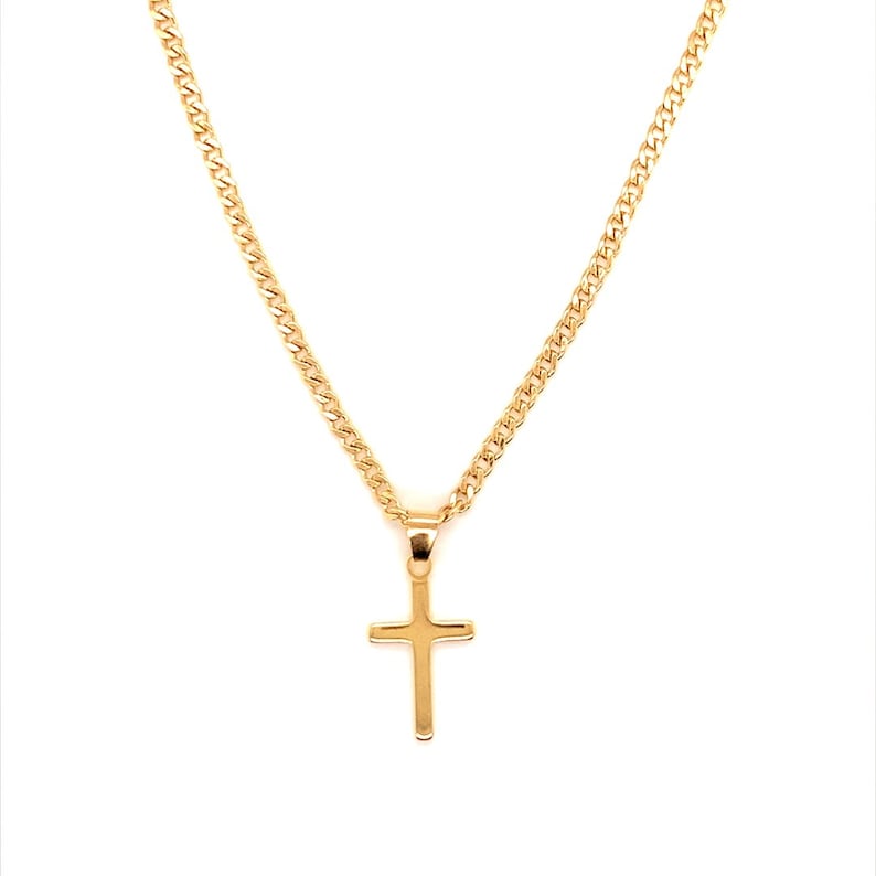 May include: A gold chain necklace with a small gold cross pendant.