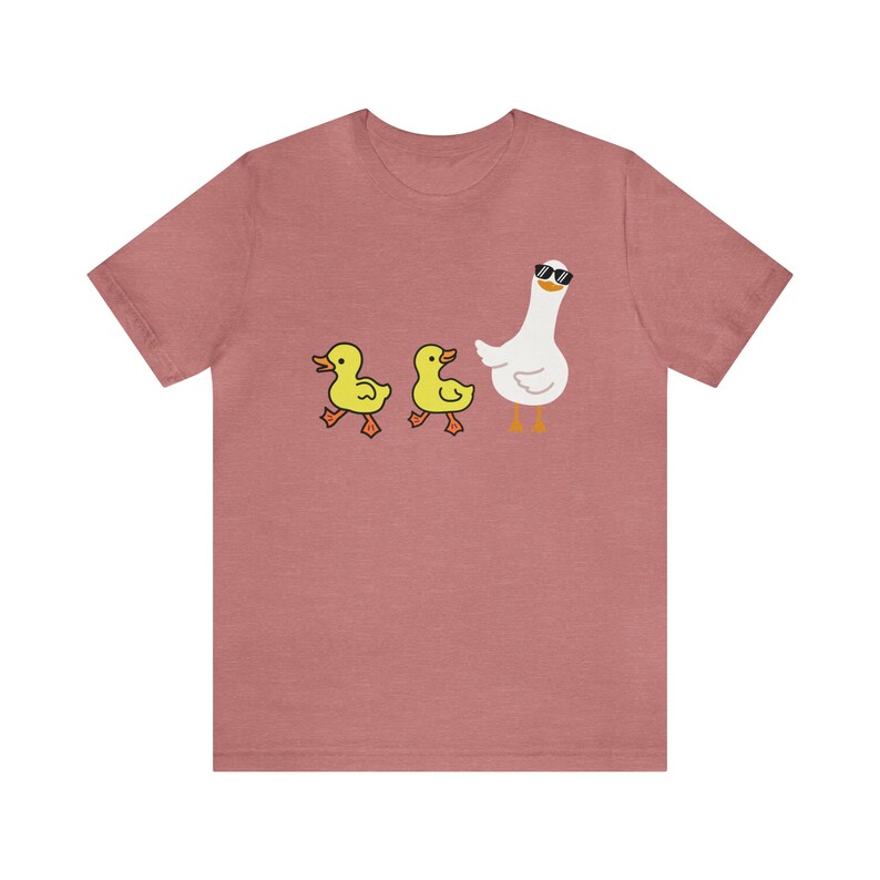 BELLA AND CANVAS T SHIRT WITH A CUTE DESIGN OF TWO DUCKS AND THEN A GOOSE.  AVAILABLE IN DARK GREY HEATHER, HEATHER MAUVE, NAVY, BLACK, ATHLETIC HEATHER AND HEATHER SLATE.