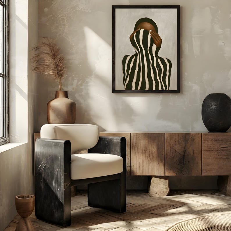 black woman art print painted as an abstract faceless portrait hanging in a Japandy interior