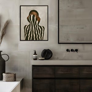 abstract Afro woman poster hanging in a minimalist bathroom