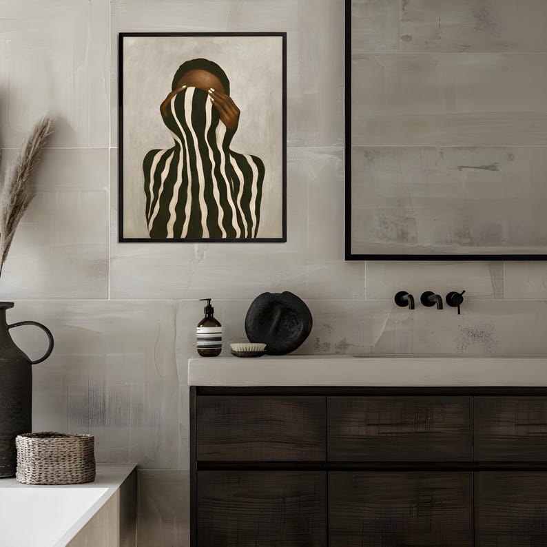 abstract Afro woman poster hanging in a minimalist bathroom