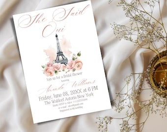 May include: A white bridal shower invitation with pink watercolor flowers and a black and white illustration of the Eiffel Tower. The text reads "She Said Oui" and includes the bride's name, date, time, and location.
