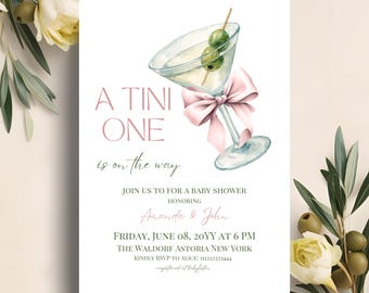 May include: Baby shower invitation featuring a watercolour martini glass with olives and a pink bow. The text reads "A Tini One is on the way" and includes event details for Amanda & John.