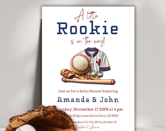 May include: A baby shower invitation with a baseball theme. The invitation features a baseball glove, bat, ball, and a baseball jersey. The text on the invitation reads "A little Rookie is on the way!" and includes the names "Amanda & John" and the date and time of the shower.