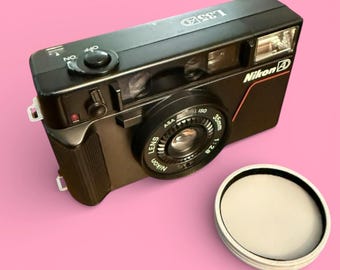 Tapa del objetivo para Nikon L35AD - "Pikaichi"