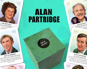May include: A green box set of the "Deck Heads" unofficial trivia card game, featuring images of Alan Partridge and other characters from the comedy TV show. The cards and box have the show's logo and character names.