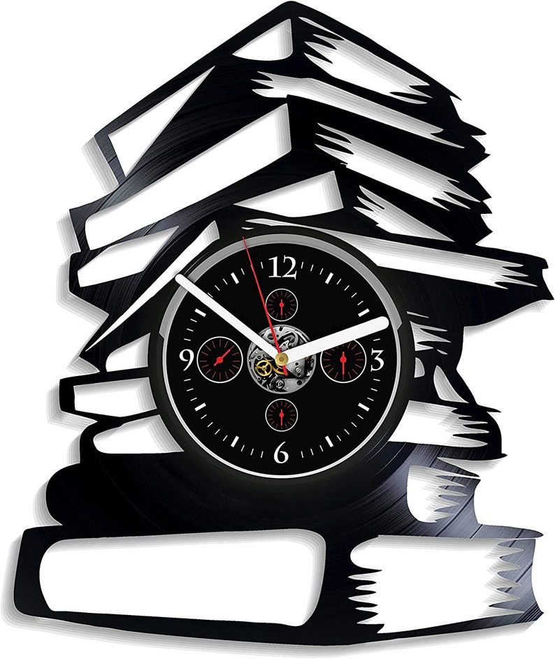 May include: A black wall clock shaped like a stack of books. The clock face is black with white hands and red accents. The clock is made from a vinyl record and has a unique, artistic design.