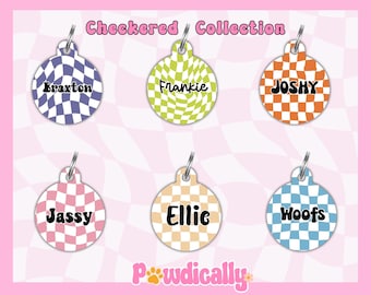 May include: Six round, colorful, checkered dog tags with different names on each. The names are Braxton, Frankie, Joshy, Jassy, Ellie, and Woofs. The tags are all on a white and black checkered background.