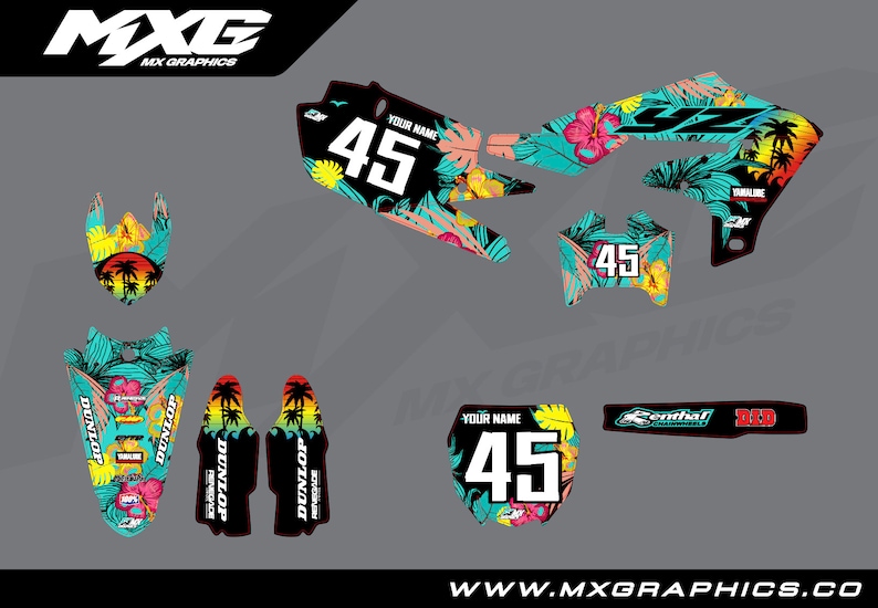 May include: A set of motocross graphics featuring a tropical floral design with palm trees, hibiscus flowers, and a turquoise background. The graphics include a number plate, front fender, rear fender, side panels, and swingarm. The graphics are designed for a Yamaha motorcycle and include the text "MXG" and "Dunlop".