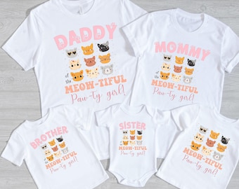 May include: Set of five white t-shirts with pink text and cat illustrations. The shirts say "Daddy of the Meow-tiful Paw-ty girl!" "Mommy of the Meow-tiful Paw-ty girl!" "Sister of the Meow-tiful Paw-ty girl!" "Brother of the Meow-tiful Paw-ty girl!" and "Meow-tiful Paw-ty girl!"