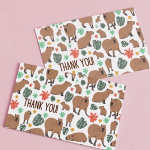 May include: Two white greeting cards with a repeating pattern of capybaras and tropical leaves. The text "Thank You!" is printed in brown on each card.