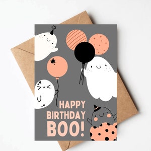 May include: A gray card with a happy birthday message that says "Happy Birthday Boo!" with a ghost holding a black balloon and other ghosts with orange and white balloons.