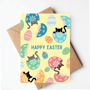May include: A yellow card with the text "Happy Easter" and black cats peeking out of colorful, cracked Easter eggs.