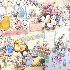 May include: A collection of Easter-themed paper cutouts and embellishments. Includes images of bunnies, chicks, eggs, carrots, and floral elements. The phrase "Somebunny Loves You" is visible, along with "Happy Easter" on an egg-shaped card. The color palette is soft pastels.