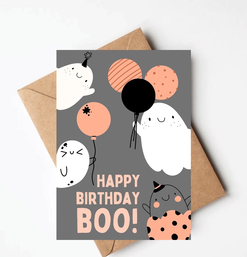 May include: A gray card with a happy birthday message that says "Happy Birthday Boo!" with a ghost holding a black balloon and other ghosts with orange and white balloons.