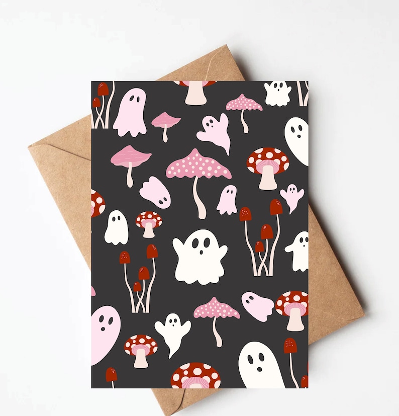 May include: A black card with a repeating pattern of white ghosts and pink and red mushrooms. The ghosts have a simple, rounded shape with a single eye.