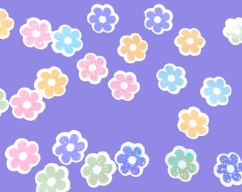 May include: A purple background with a scattering of colorful flower stickers. The stickers are in various shades of pink, blue, green, and yellow. Each sticker has a white outline and a glittery finish.