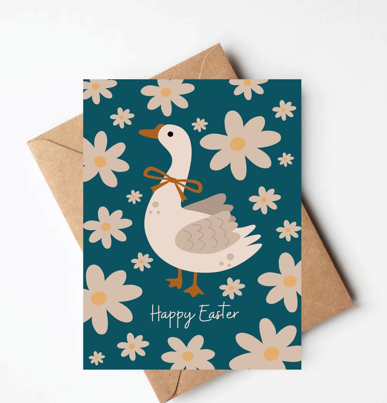 May include: A teal blue card with a white goose wearing a brown ribbon. The goose is surrounded by white daisies. The card says "Happy Easter" in white text.