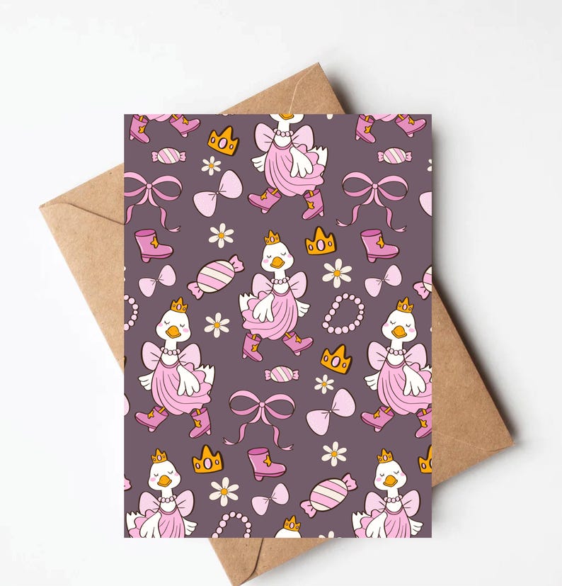 May include: A greeting card with a repeating pattern of cartoon geese wearing pink dresses, boots, and crowns. The design includes bows, candies, flowers, and necklaces on a dark purple background. The card is inside a brown envelope.
