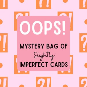 May include: A pink background with orange question marks and exclamation points. A pink square in the center reads "OOPS! MYSTERY BAG OF Slightly IMPERFECT CARDS" in black and script font.