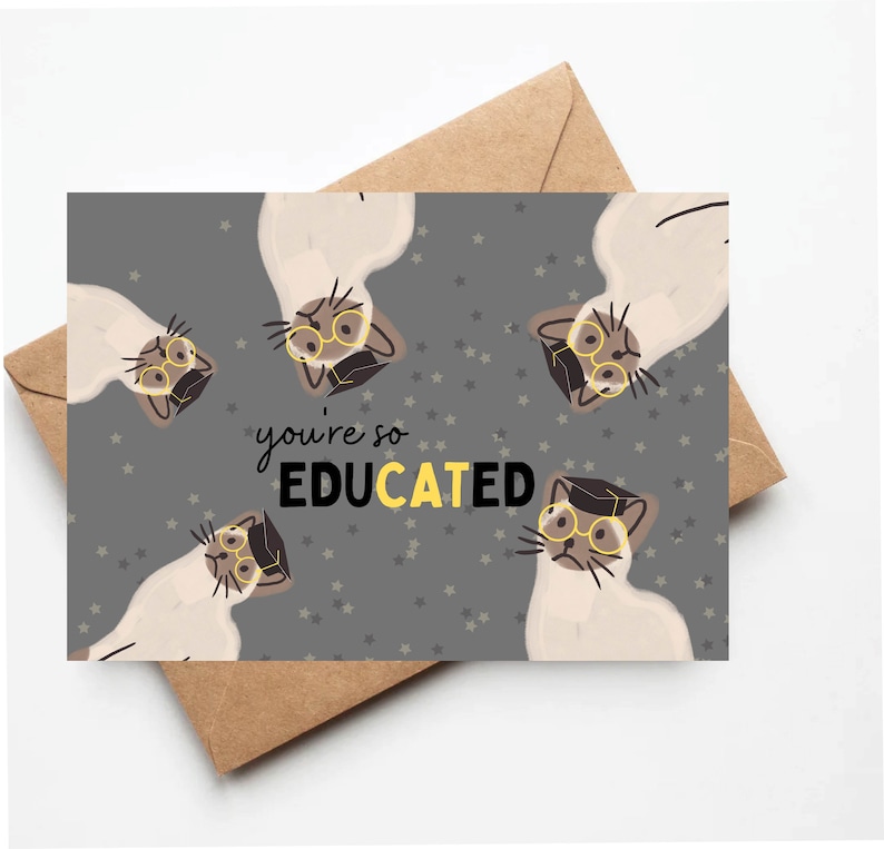 May include: A gray card with a pattern of white cats wearing glasses and graduation caps. The text "you're so EDUCATED" is written in yellow letters.