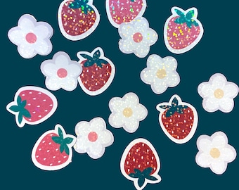 May include: A collection of sparkly red and white strawberry and flower stickers. The stickers have a holographic finish and are perfect for adding a touch of whimsy to any project.